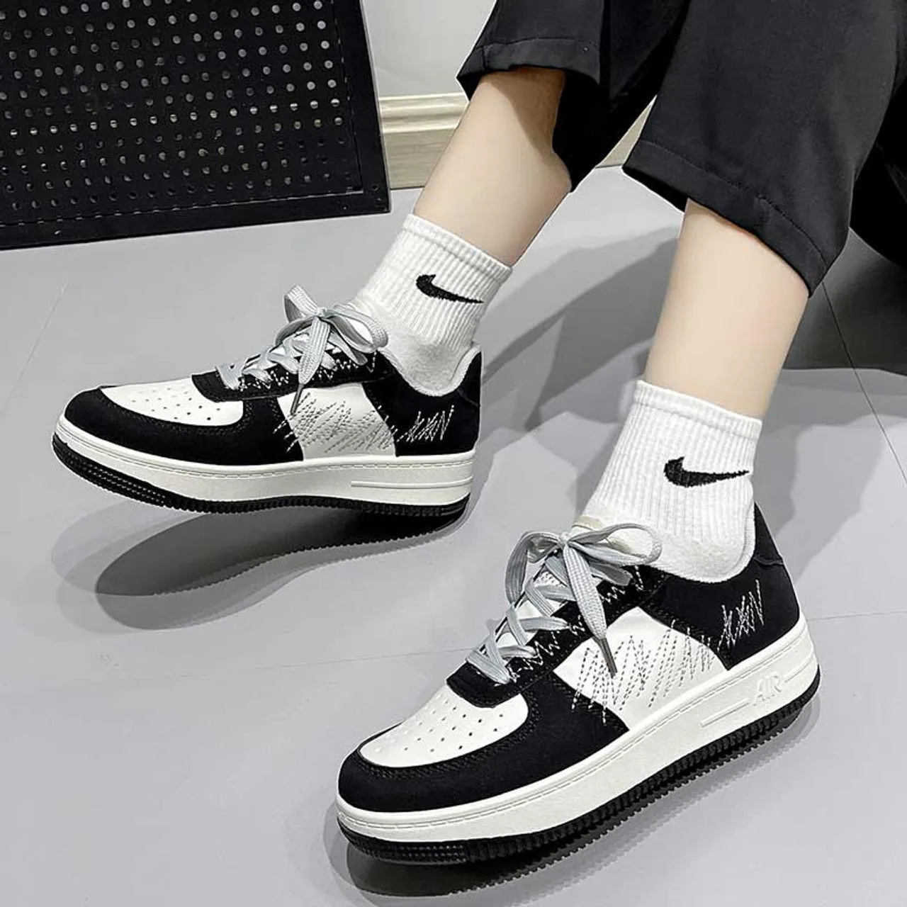 Black white casual sewn accents shoe sneaker